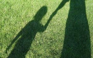 Shadow of Parent & Child Holding Hands